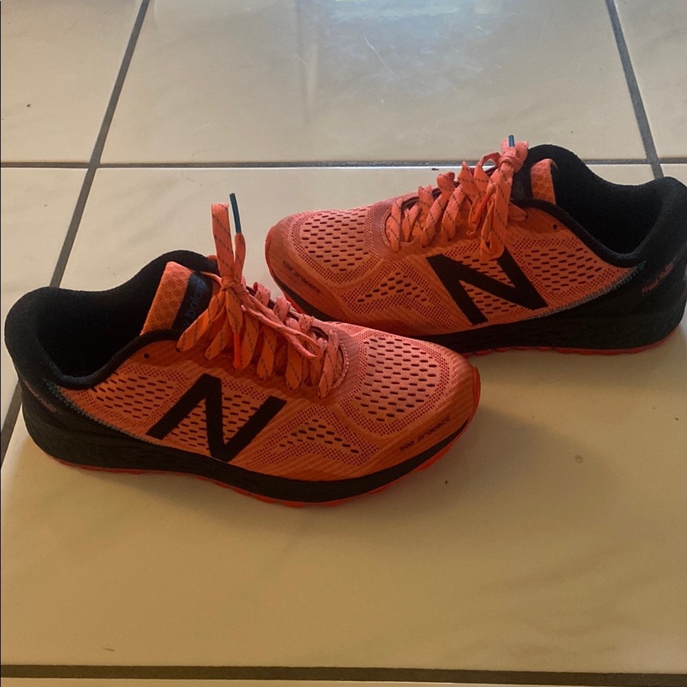 New Balance pink and black sneakers